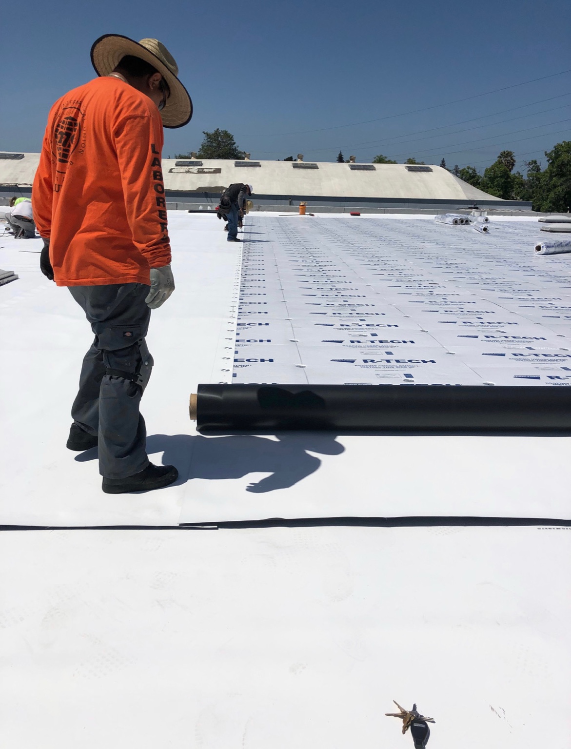 TPO membrane installation over R-Tech